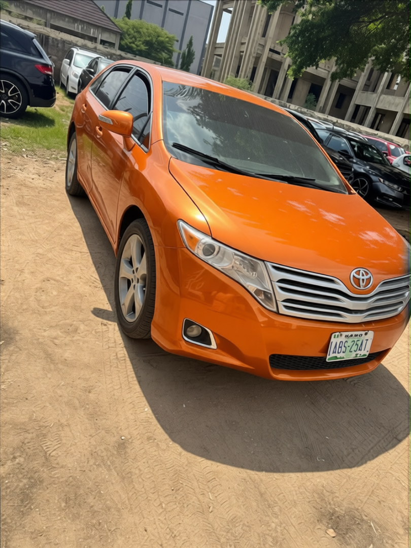 Toyota Camry rendered in Lava Orange gloss paint