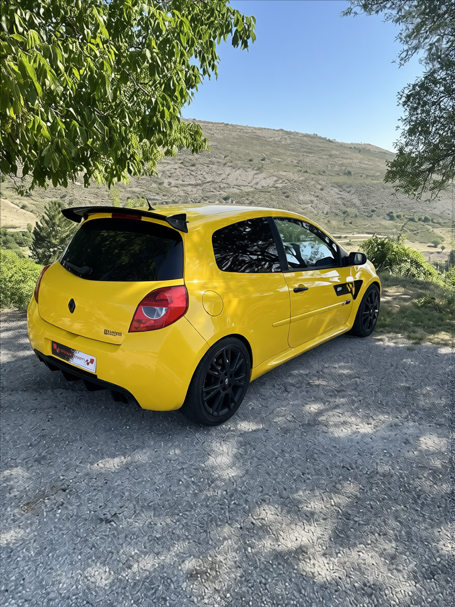 Renault Clio RS rendered in Racing Yellow gloss paint