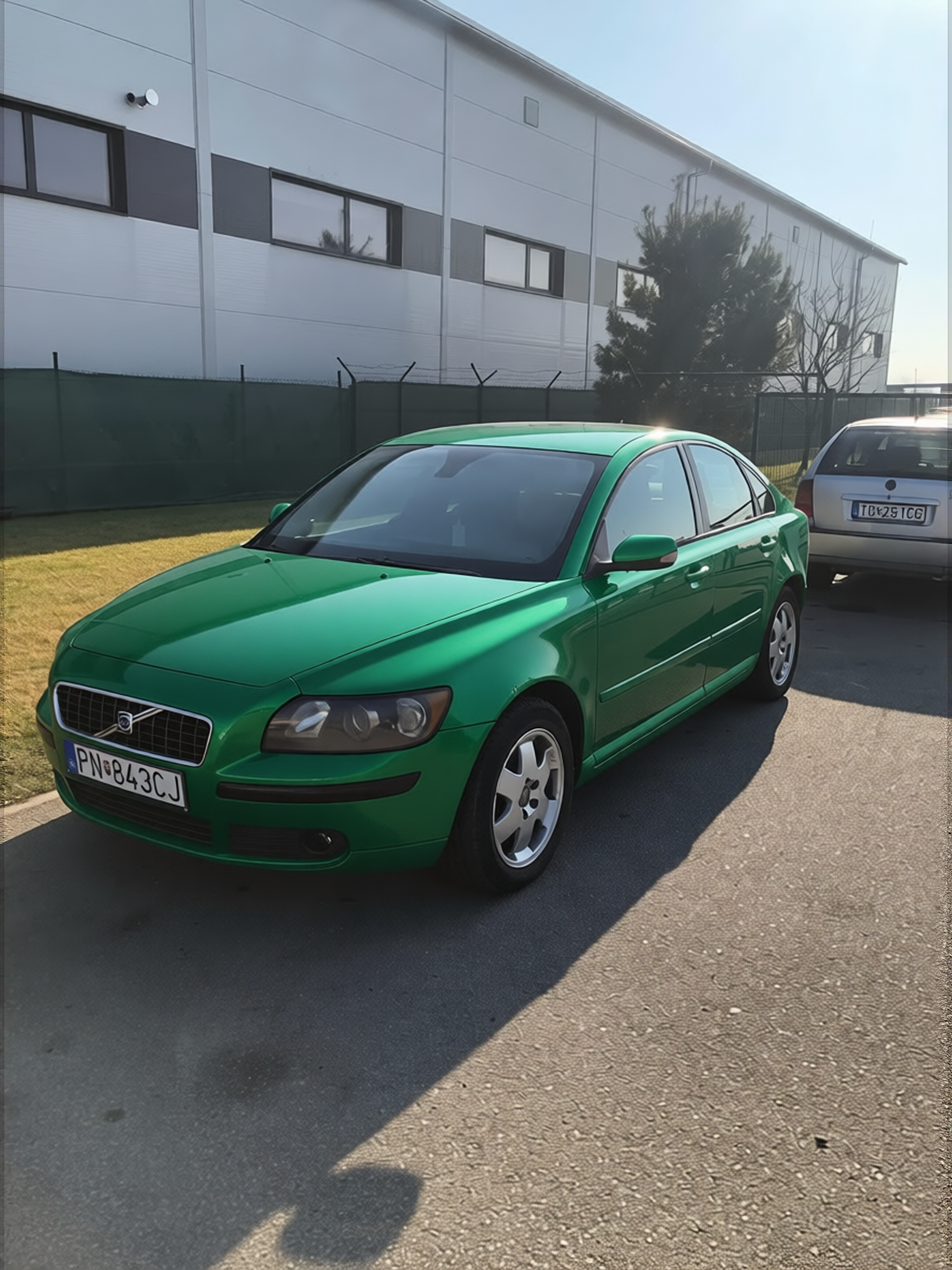 Volvo S60 rendered in Racing Green gloss paint