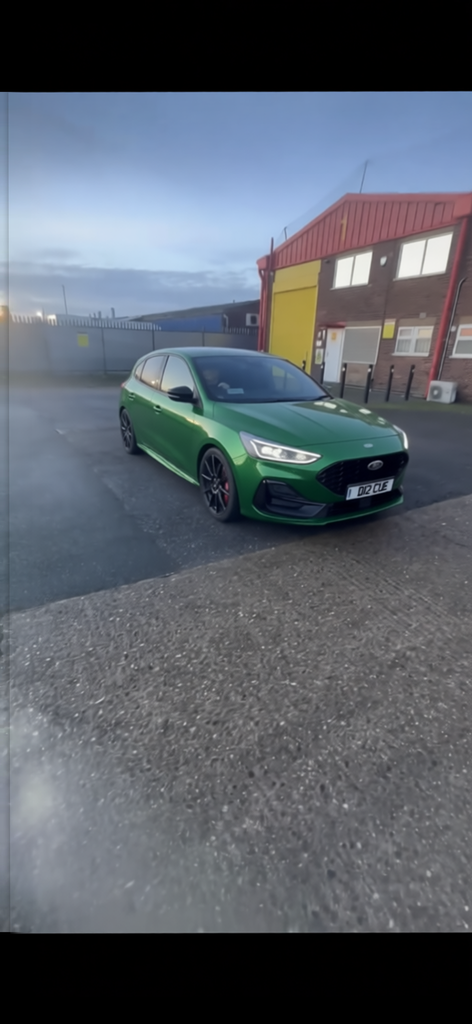 Ford Focus rendered in Racing Green gloss paint