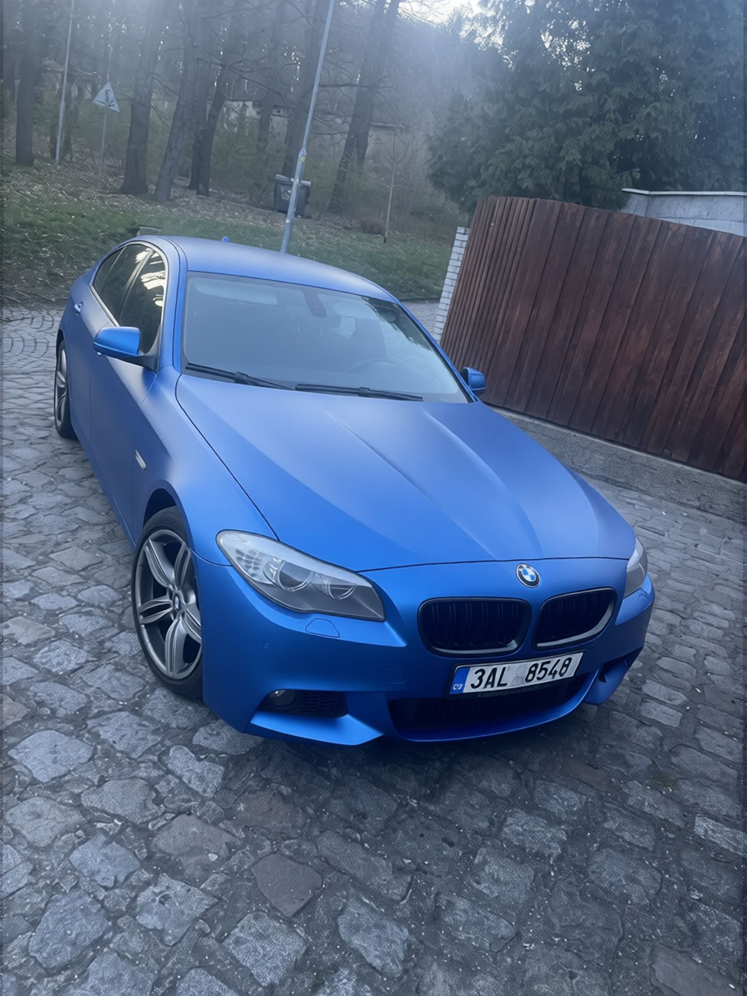 BMW 5 Series rendered in Gulf Blue matte paint